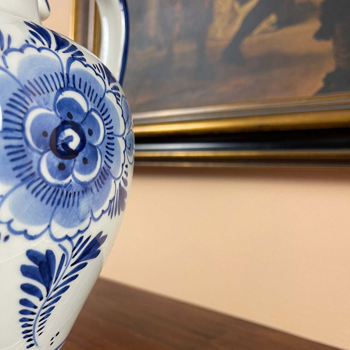 Ceramic teapot with blue floral patterns on a neutral background