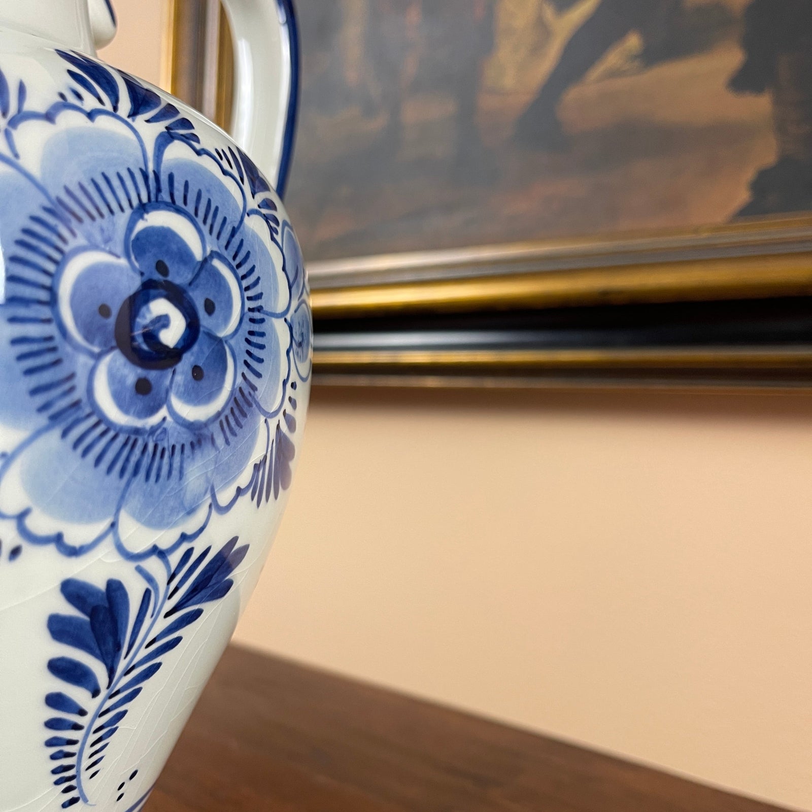 Ceramic teapot with blue floral patterns on a neutral background