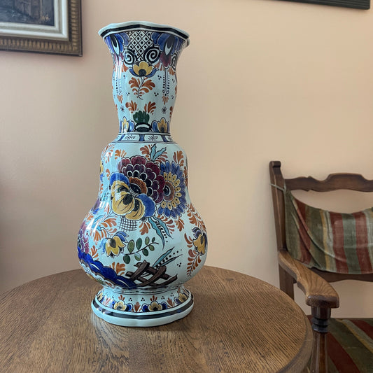 Decorative vase with floral patterns on a wooden table