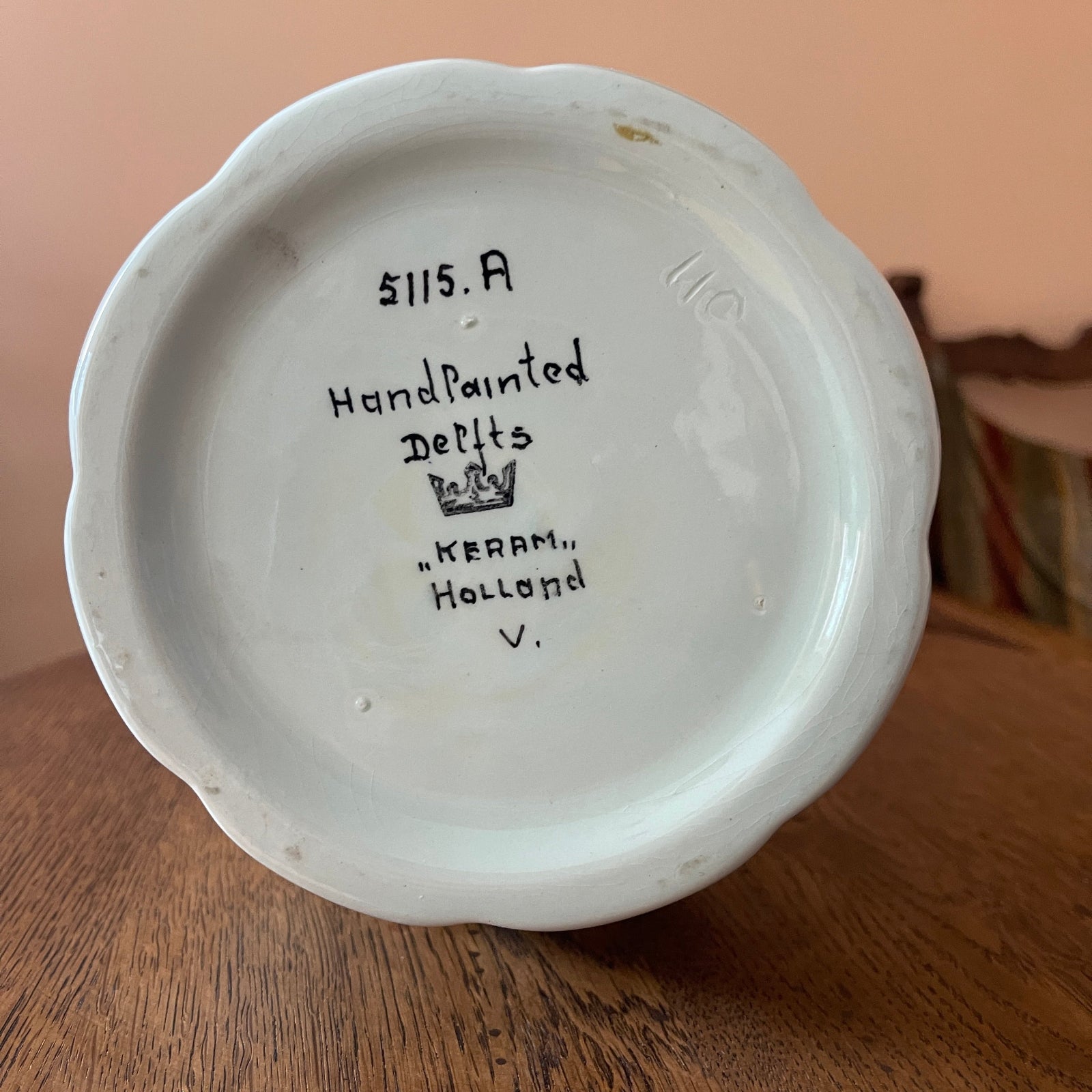 Ceramic dish with 'Kerram, Holland' branding on a wooden surface
