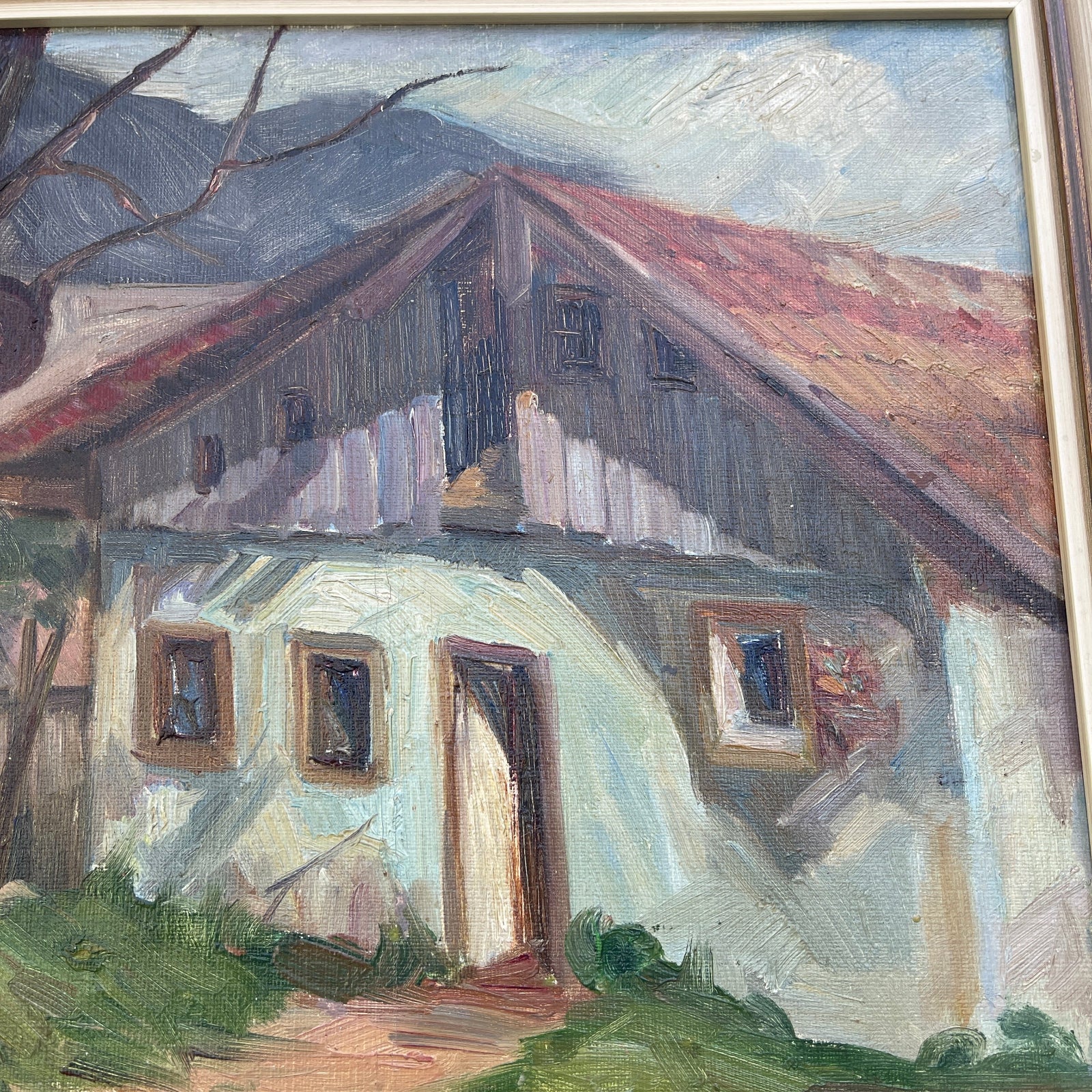Painting of a house with a mountainous background