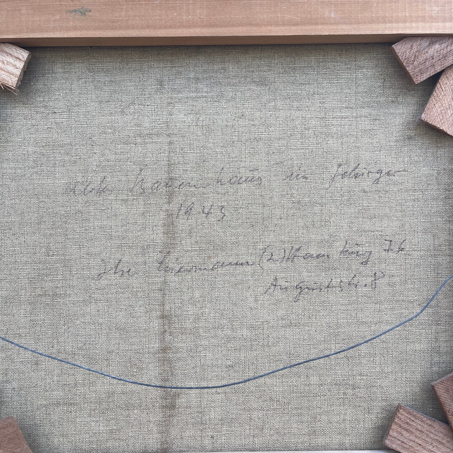 Text on a textured gray surface with wooden elements around