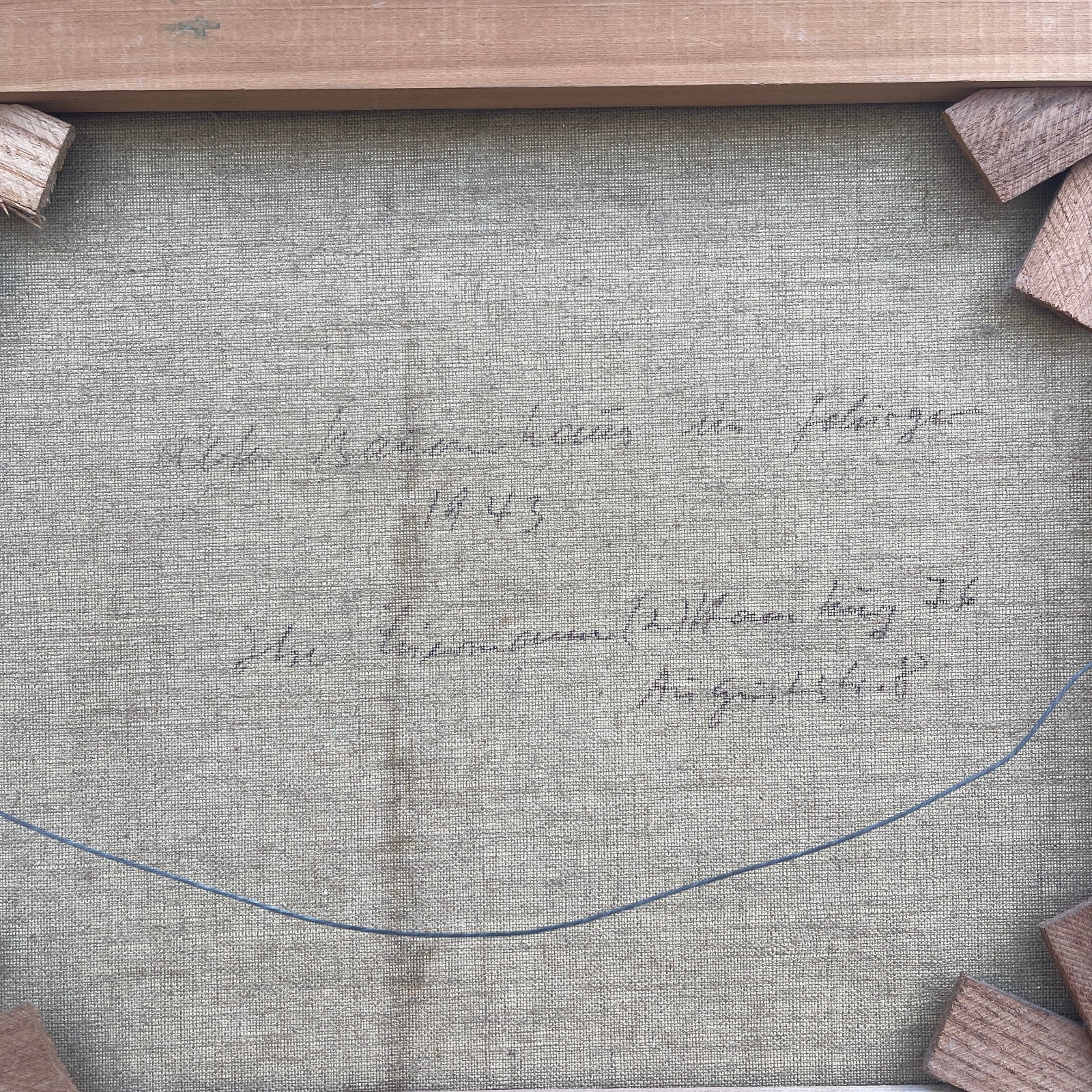 Text on a textured gray surface with wooden elements around