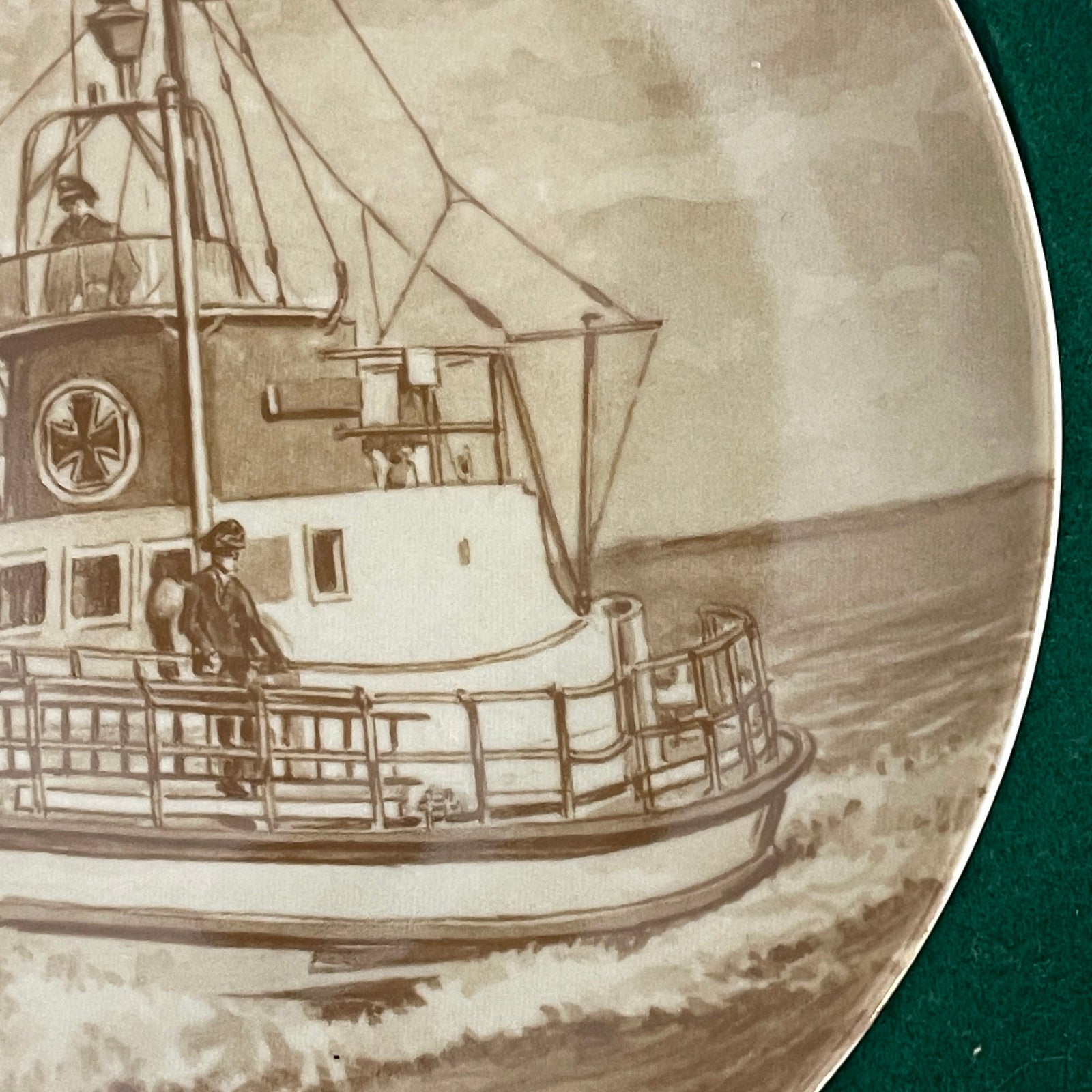 Engraved plate with a detailed illustration of a boat on water