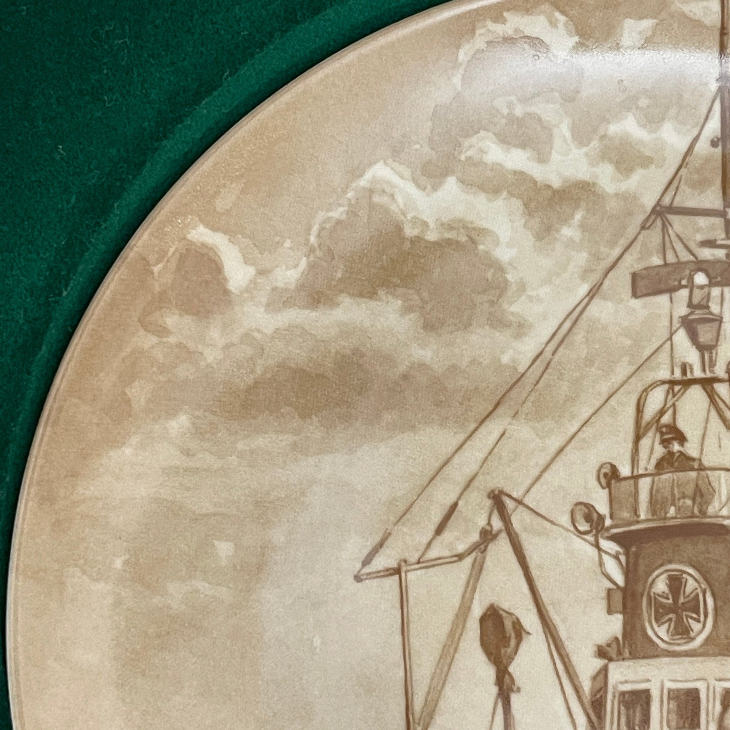 Vintage-style illustration of a ship at sea with a cloudy sky.
