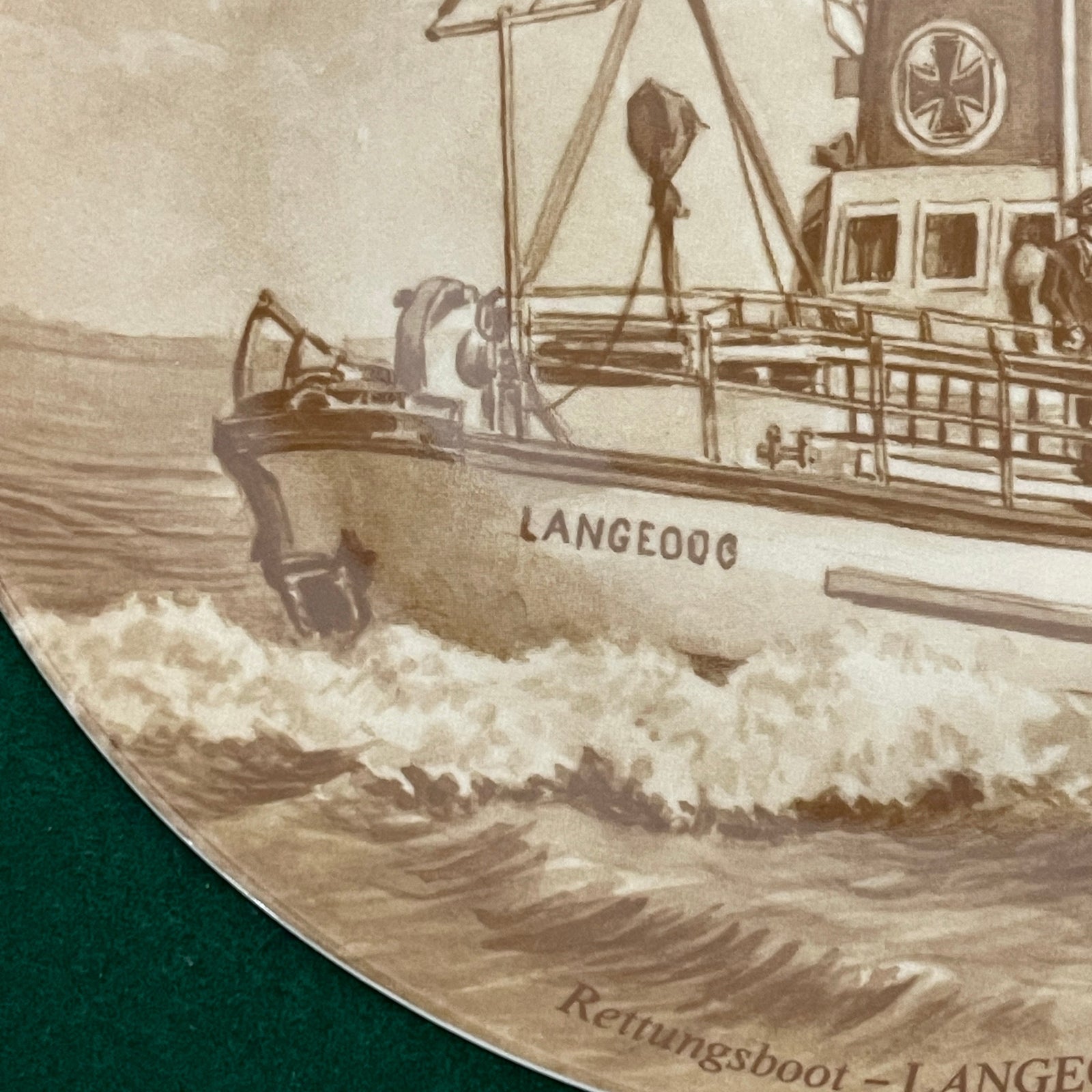 Vintage-style illustration of a boat named 'LANGEOOG' on water.