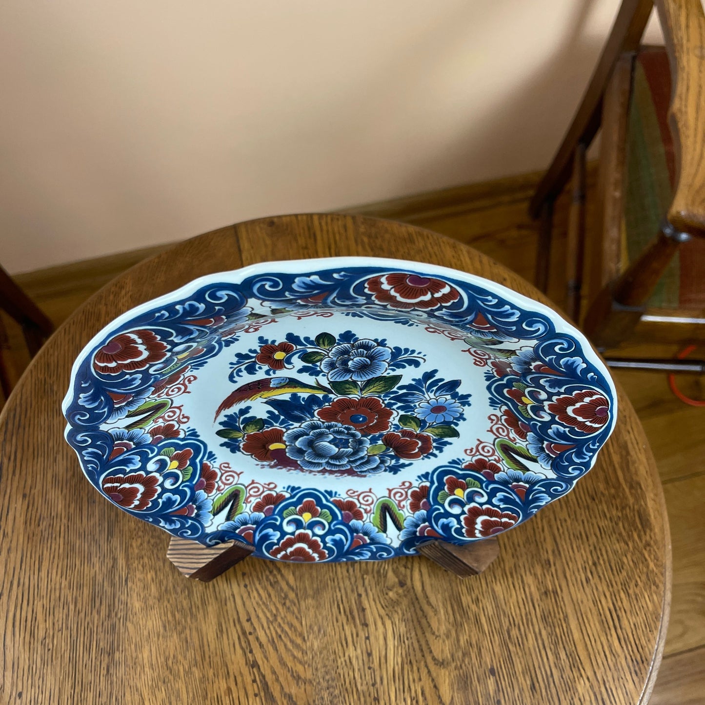 Decorative ceramic plate with floral patterns on a wooden table
