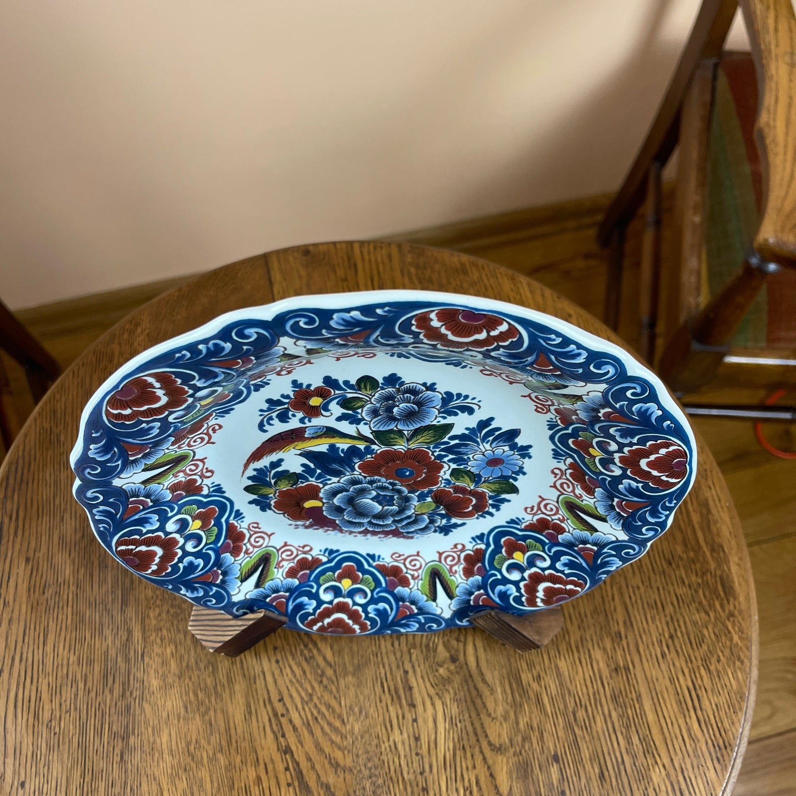 Decorative ceramic plate with floral patterns on a wooden table