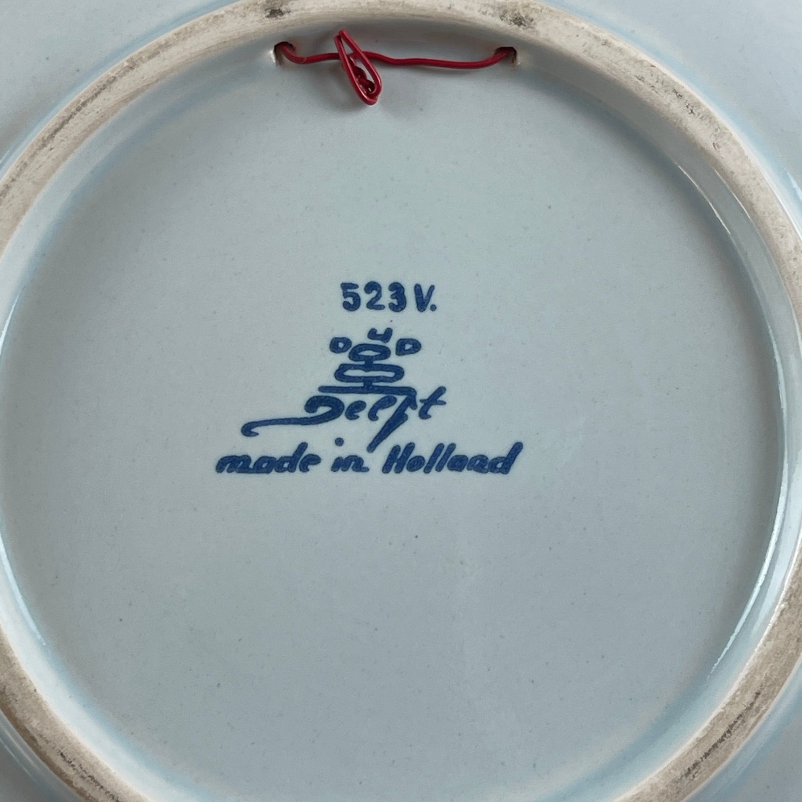 Ceramic plate with 'Deft made in Holland' inscription on a white background