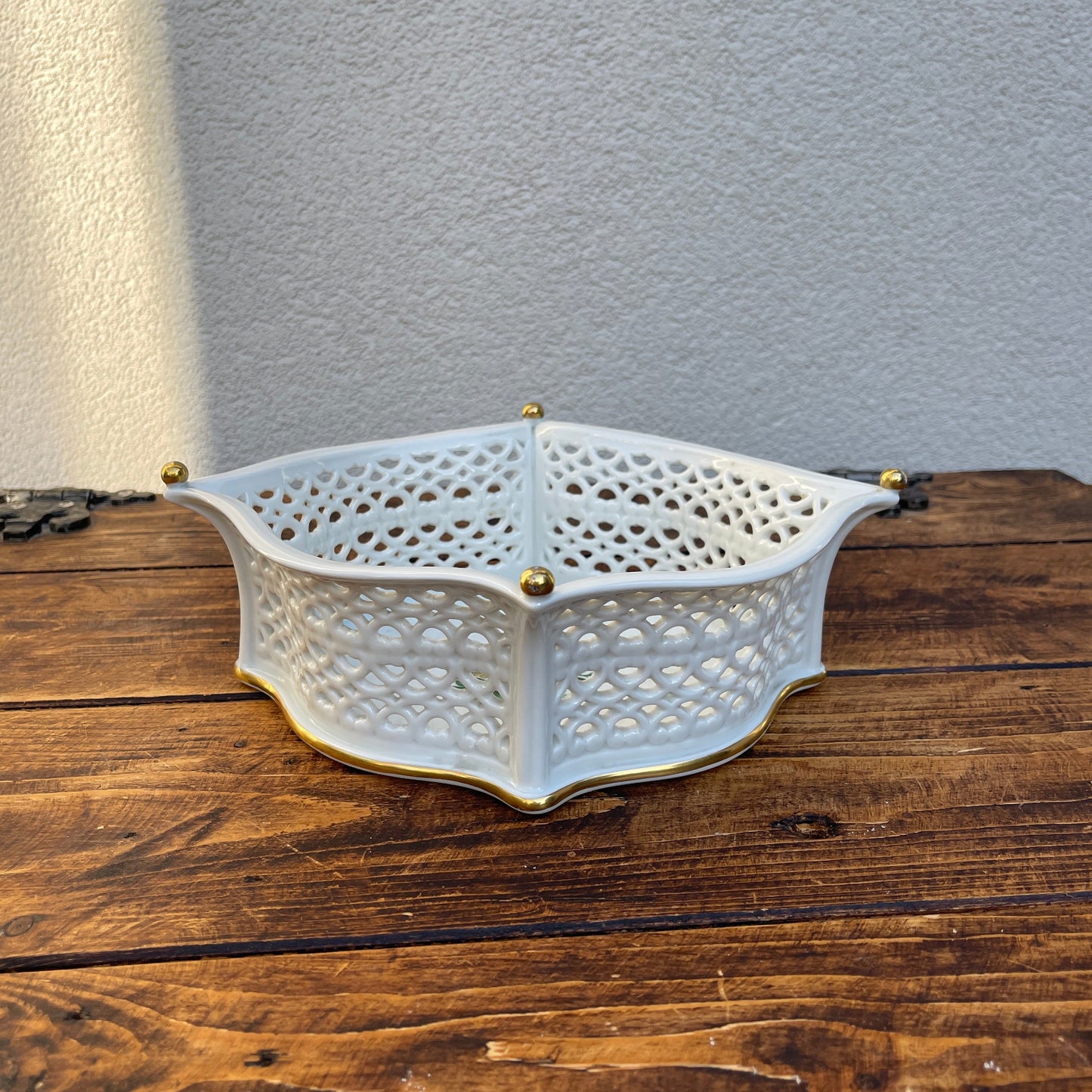 Porcelain reticulated basket with floral decoration and gold accents