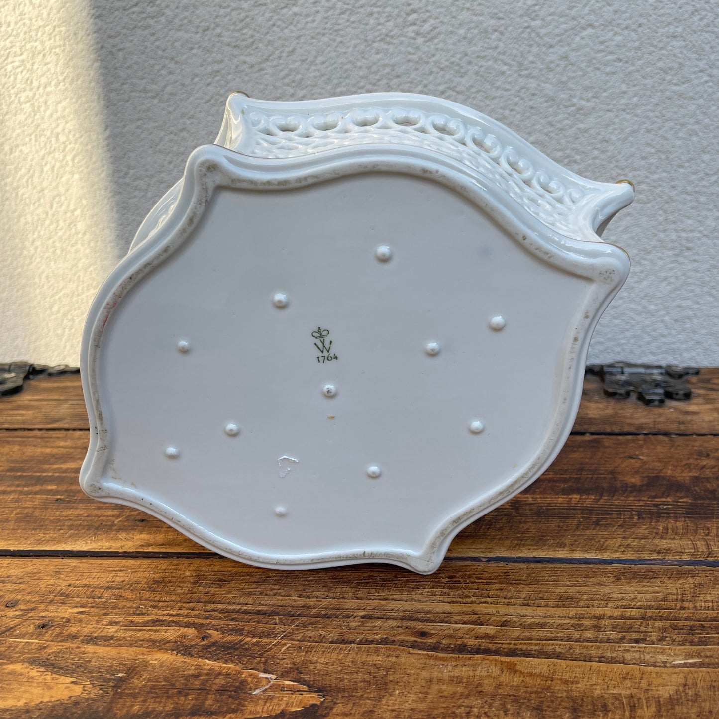 Porcelain reticulated basket with floral decoration and gold accents