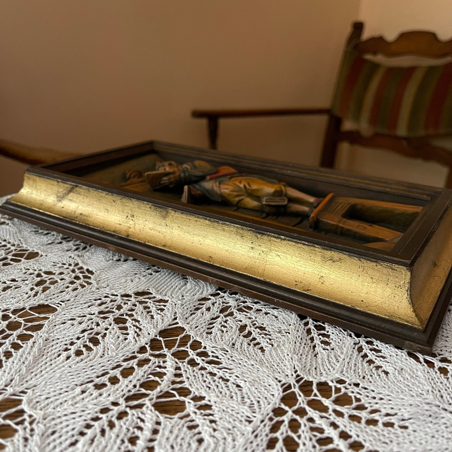 Decorative box with a cross on a lace tablecloth