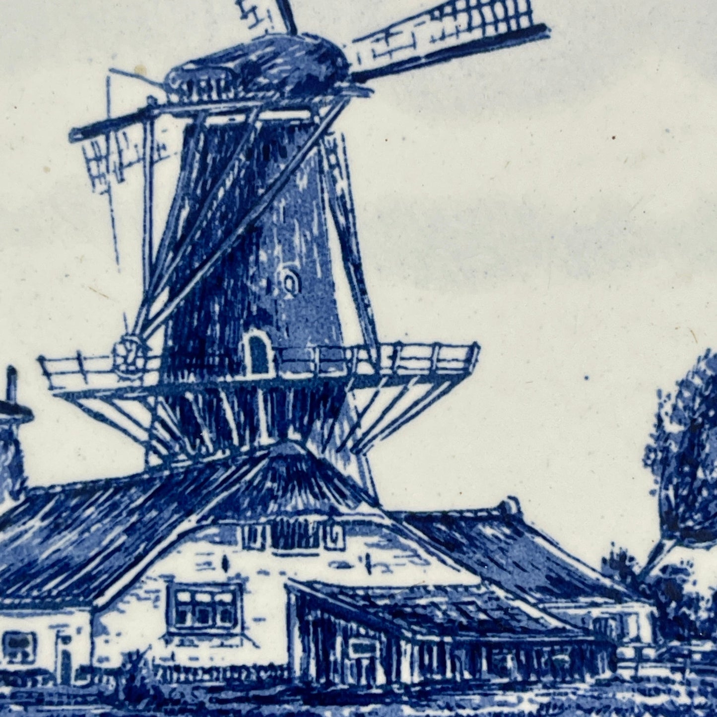 Dutch windmill depicted in blue on a white background