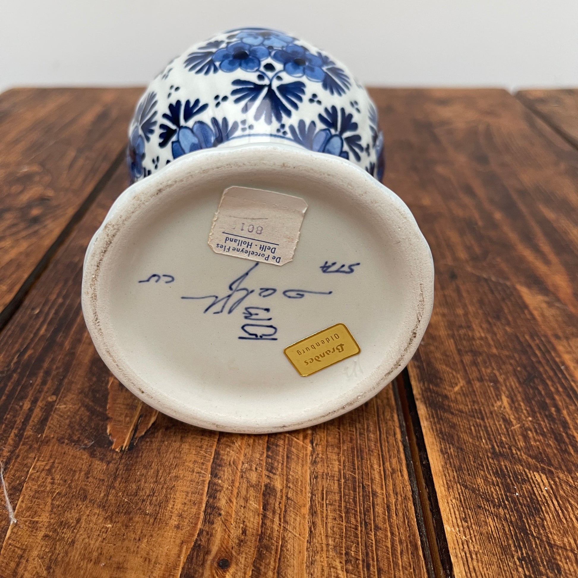 Ceramic vase with blue floral patterns on a wooden surface