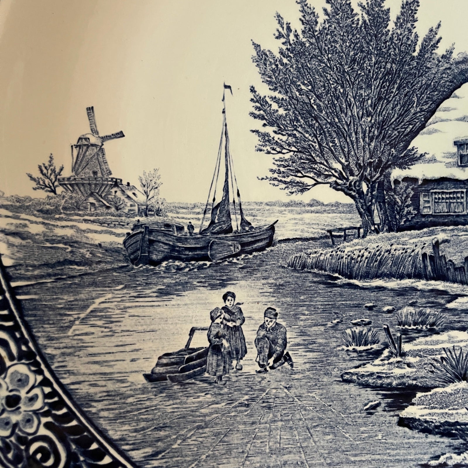 Vintage-style illustration of a canal scene with a windmill, boat, and people.