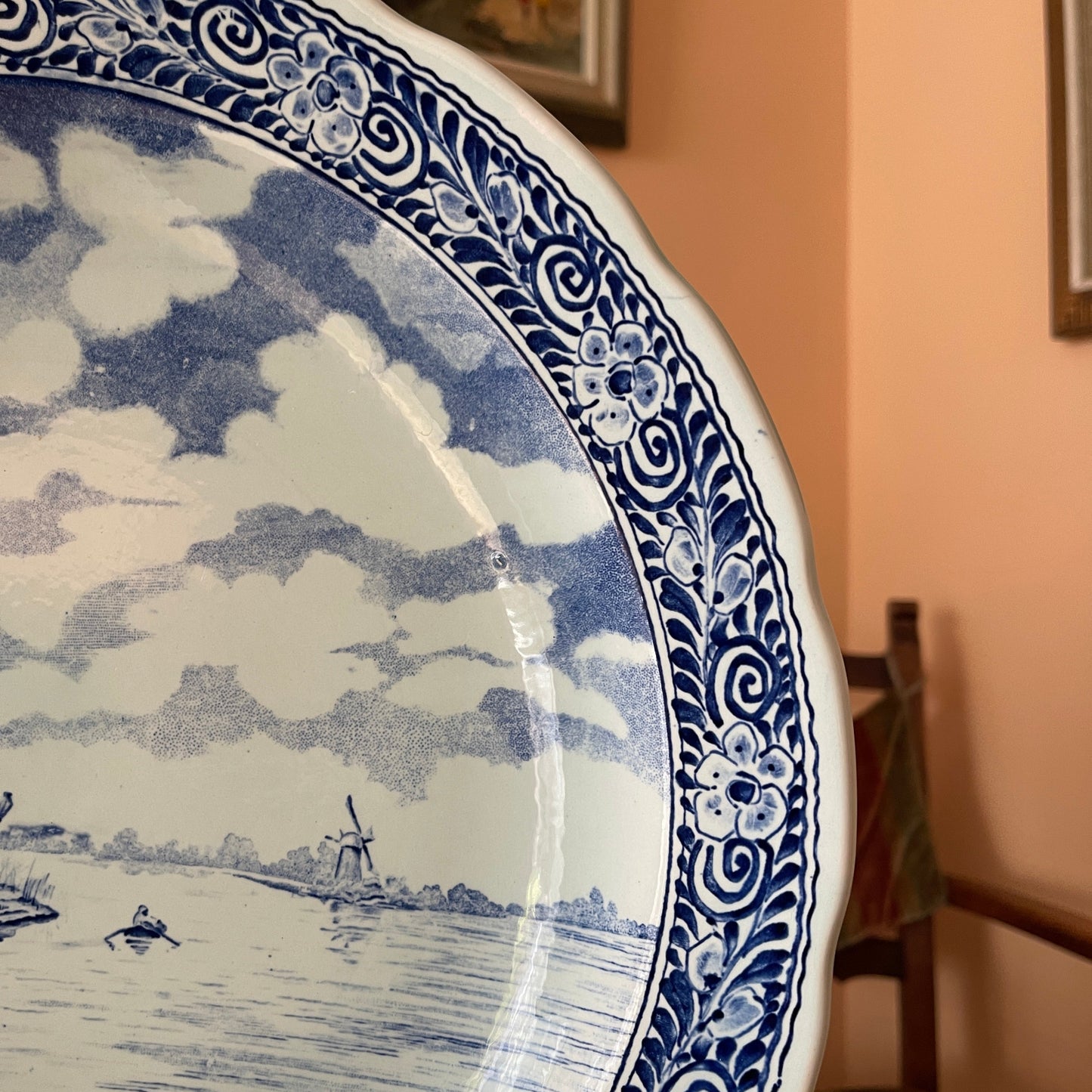 Blue and white decorative plate with a landscape design.