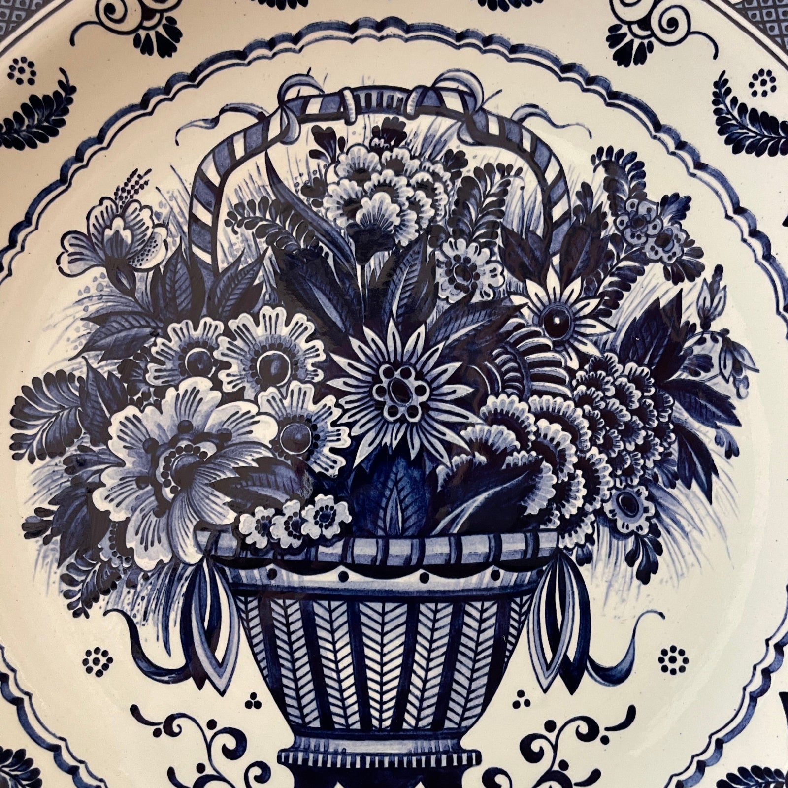 Decorative plate with blue floral design on a white background