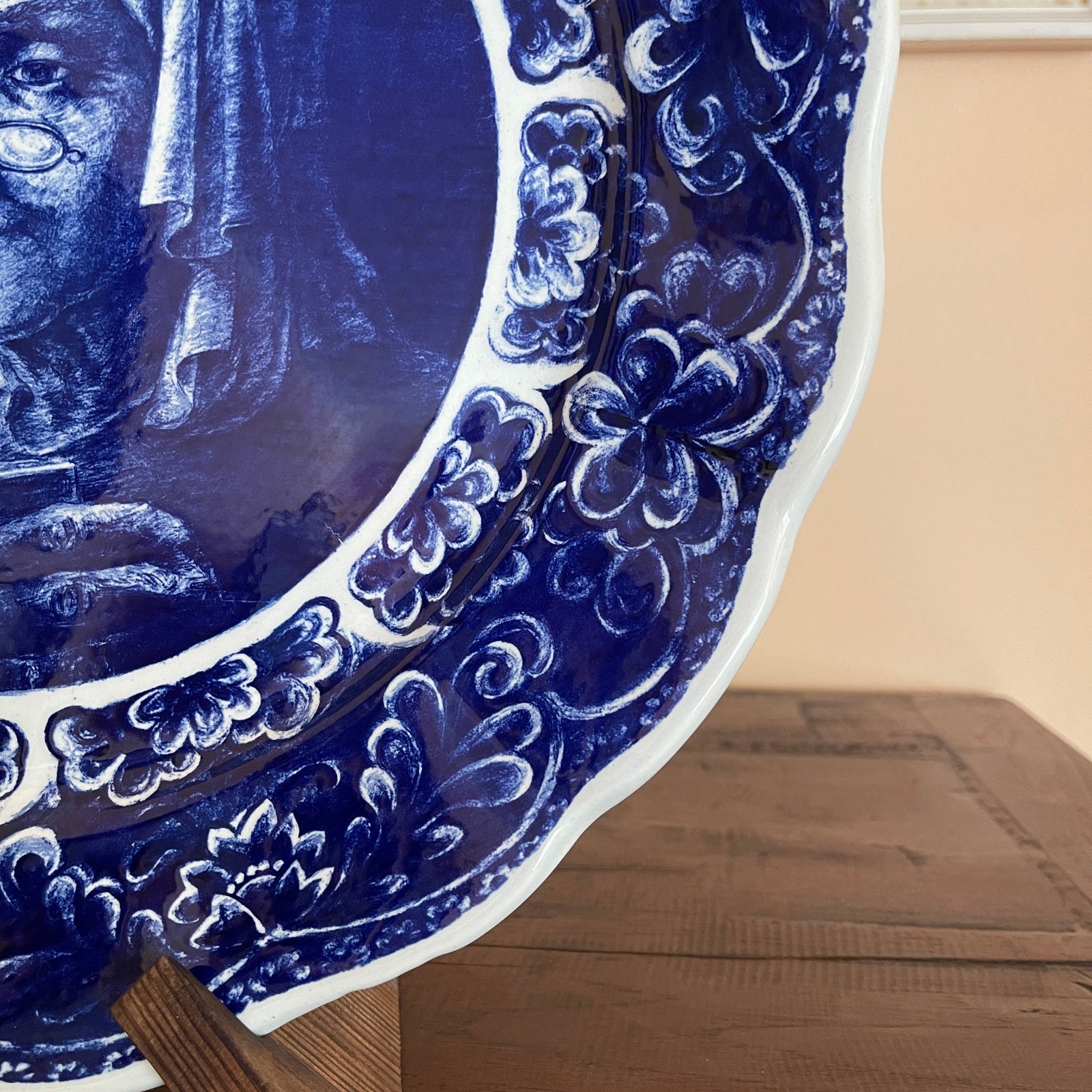 Blue and white decorative plate on a wooden surface