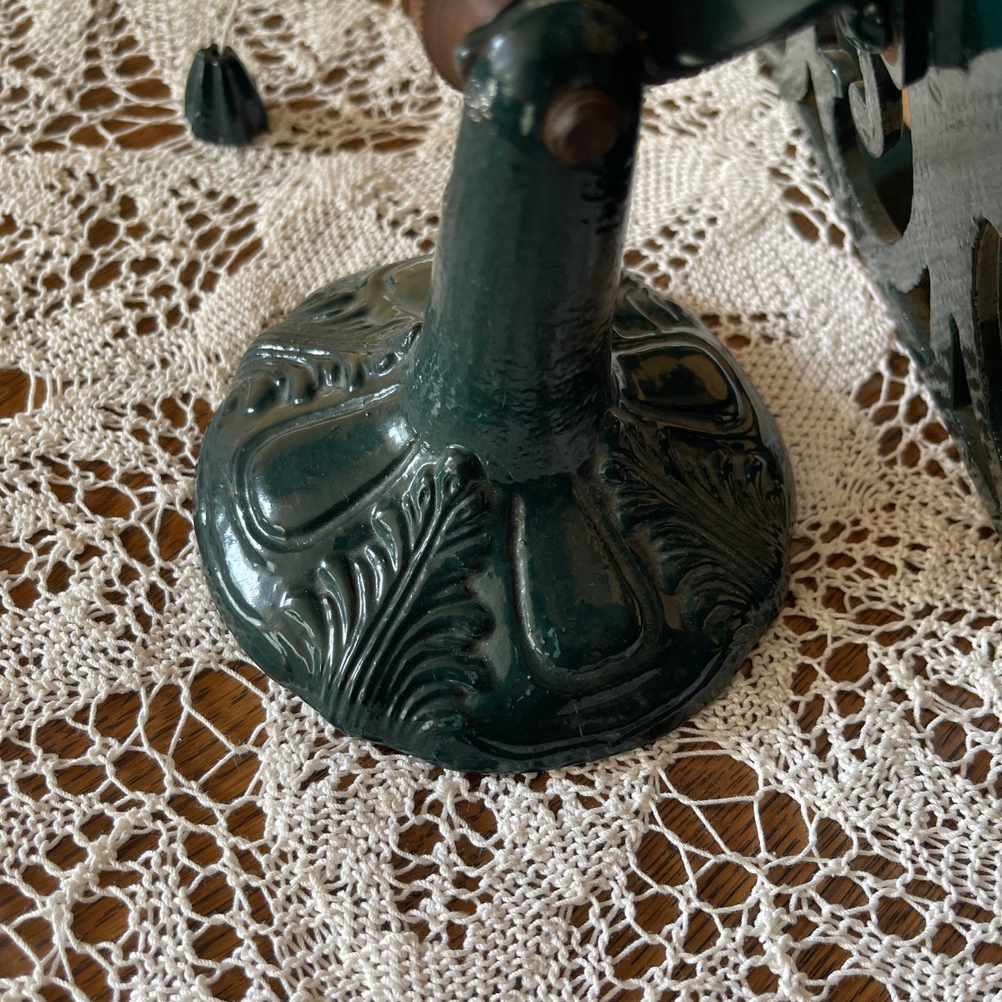 Decorative metal stand on a lace tablecloth