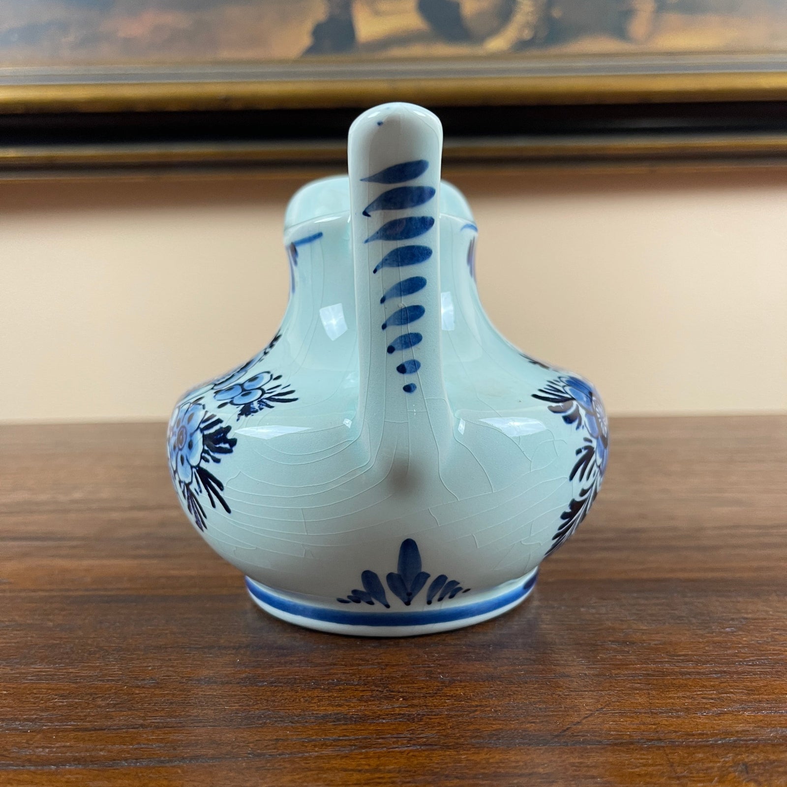 Ceramic vase with blue floral patterns on a wooden surface