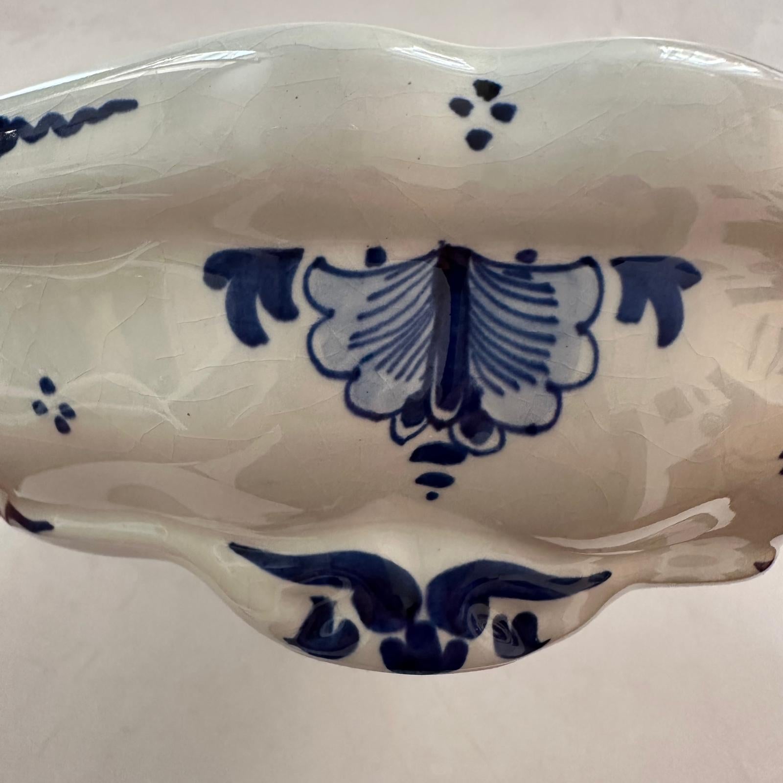 White ceramic dish with blue floral patterns on a white background