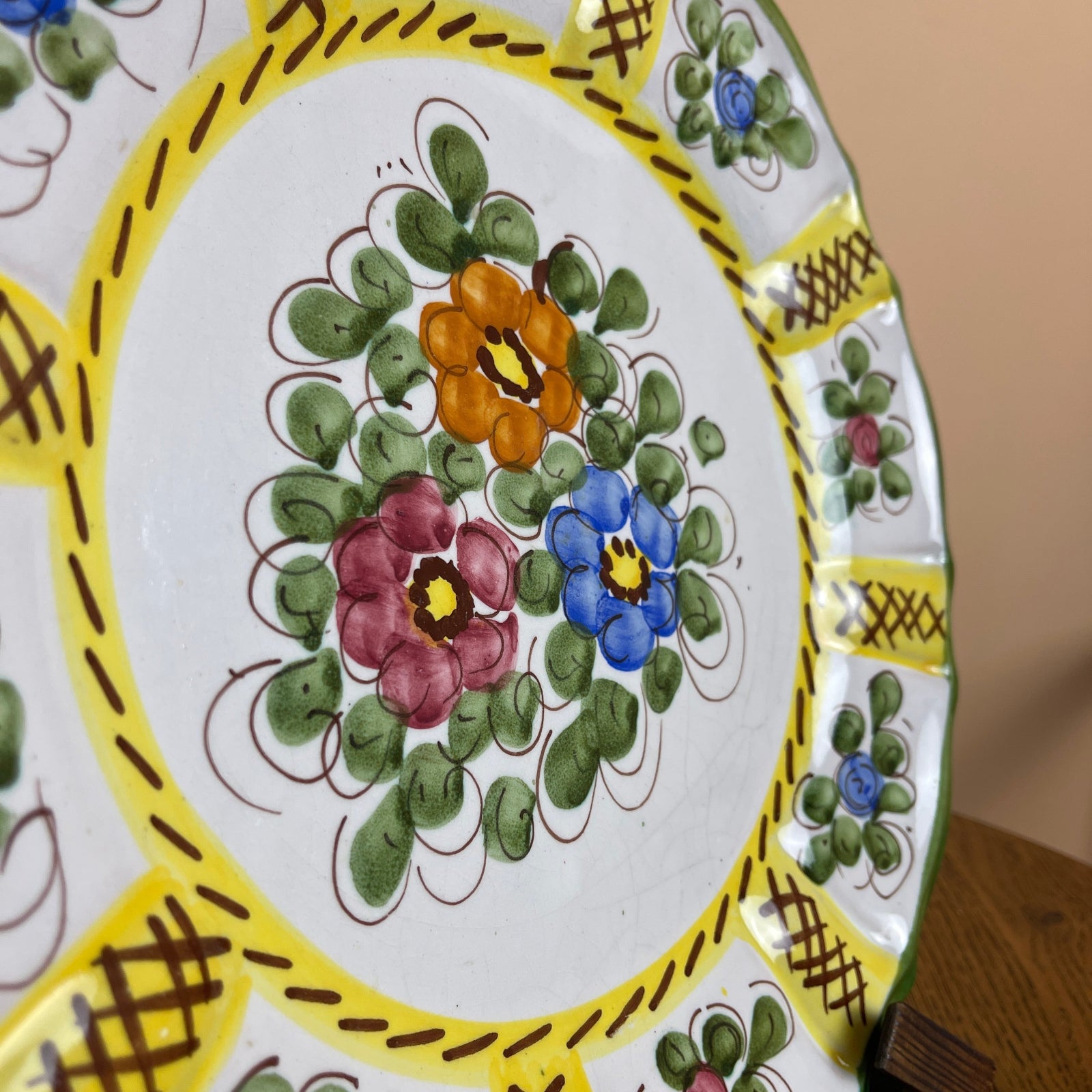 Decorative ceramic plate with floral patterns on a white background