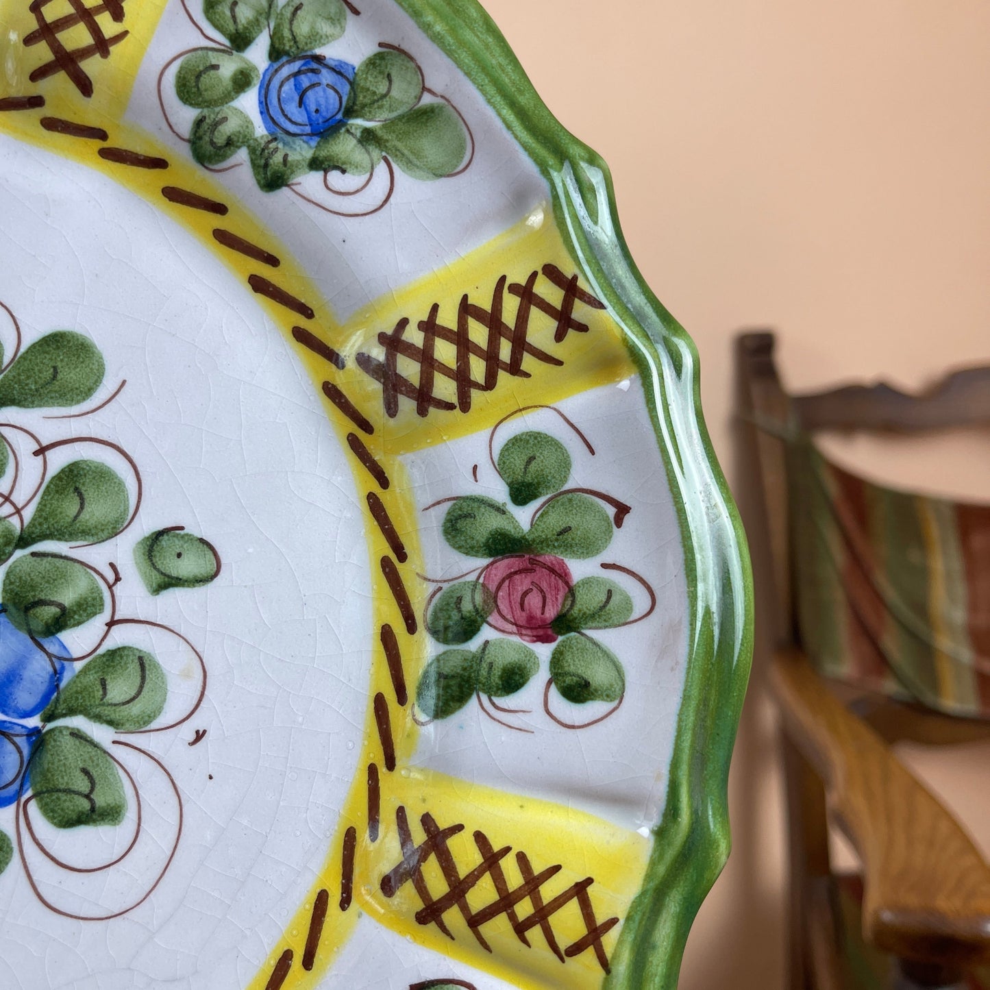 Decorative ceramic plate with floral patterns on a table.