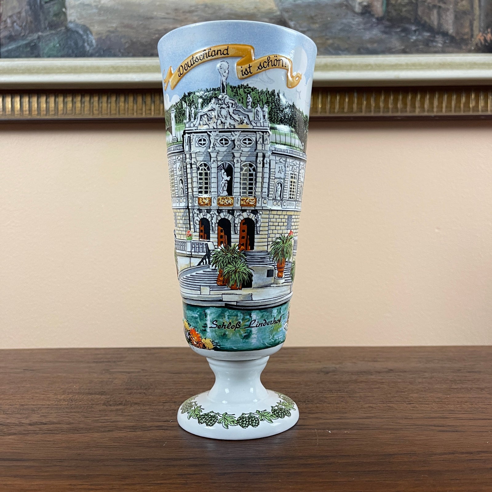 Decorative glass with architectural design on a wooden surface
