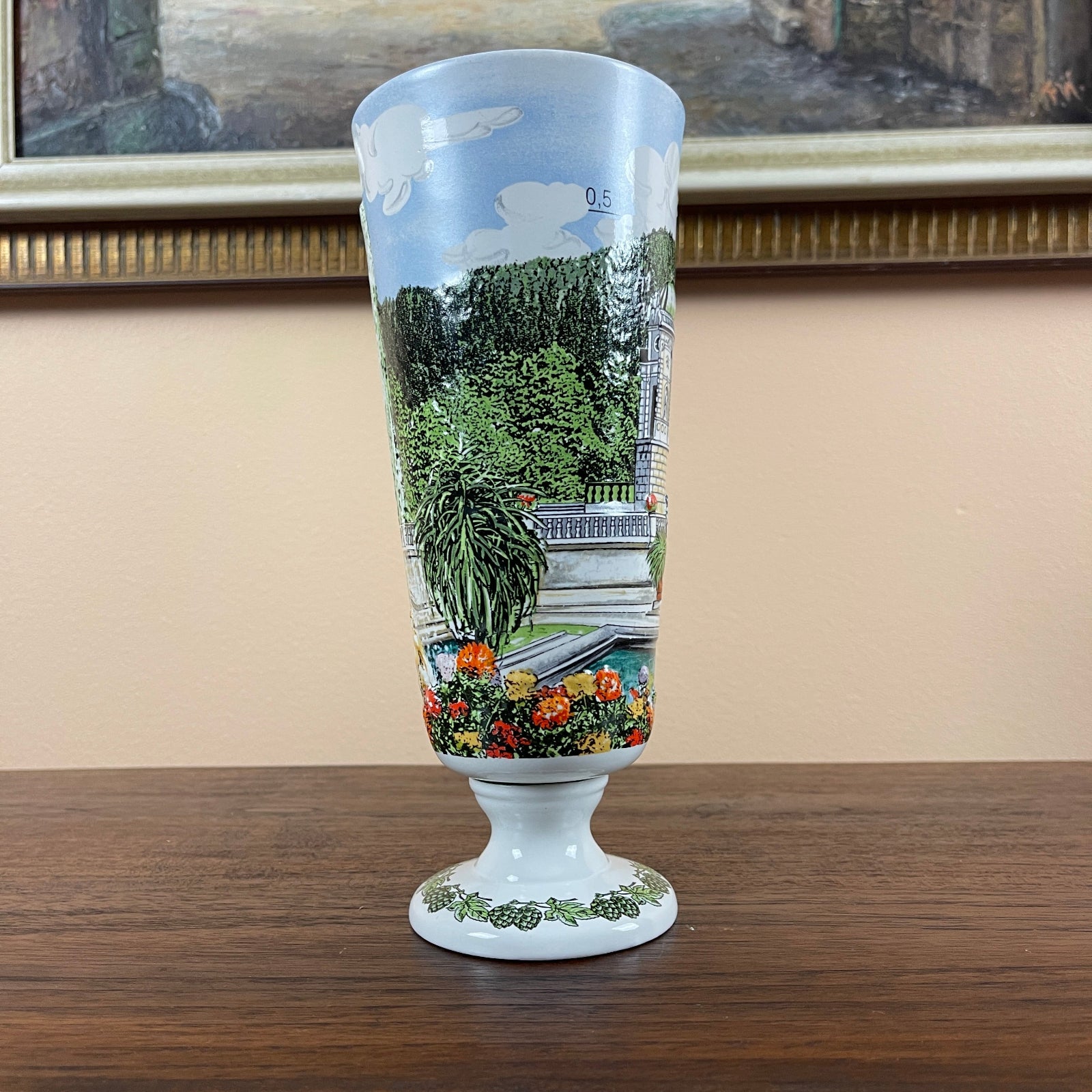 Decorative glass with a scenic design on a wooden surface