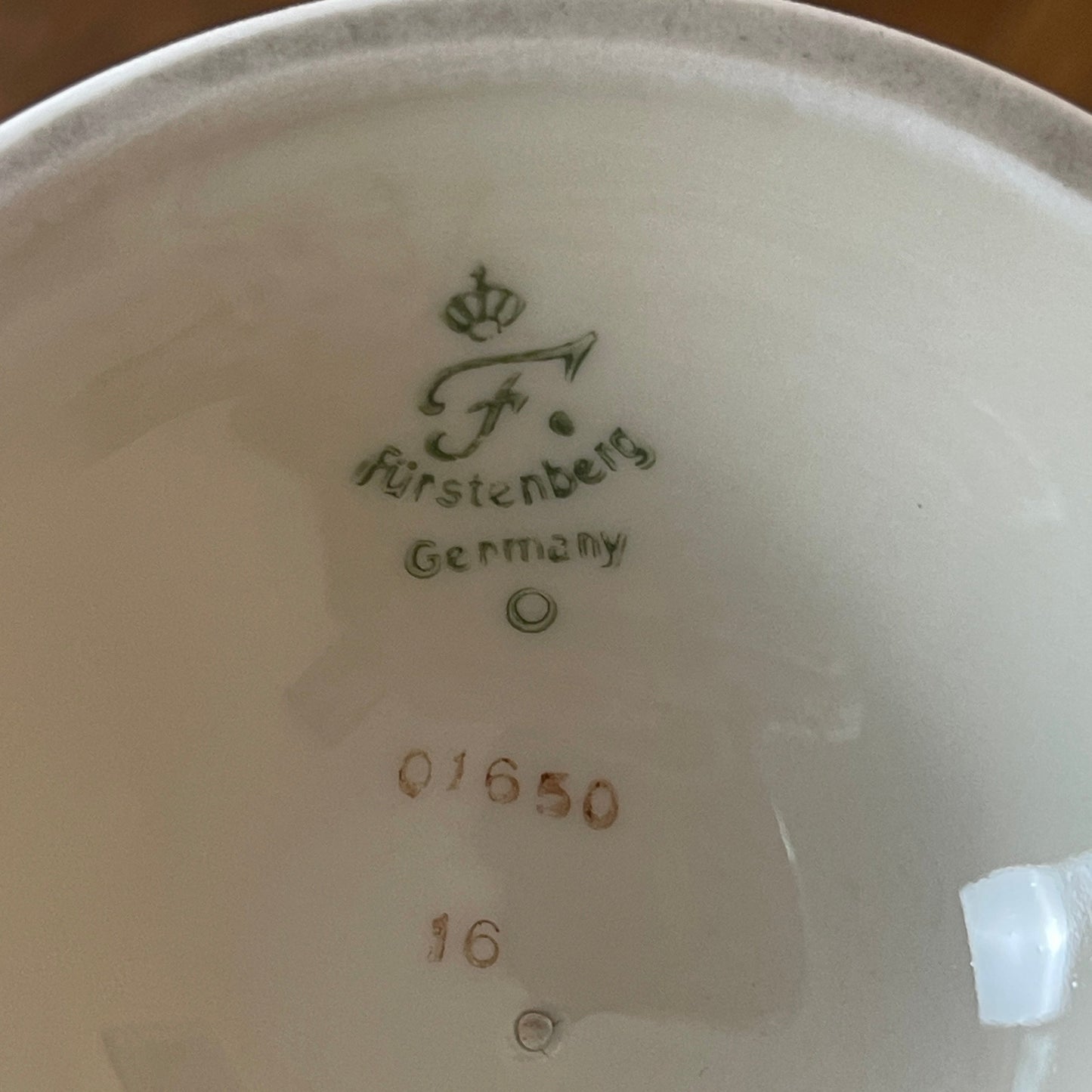 Close-up of a ceramic product with 'FÜrstenberg Germany' branding and numbers.