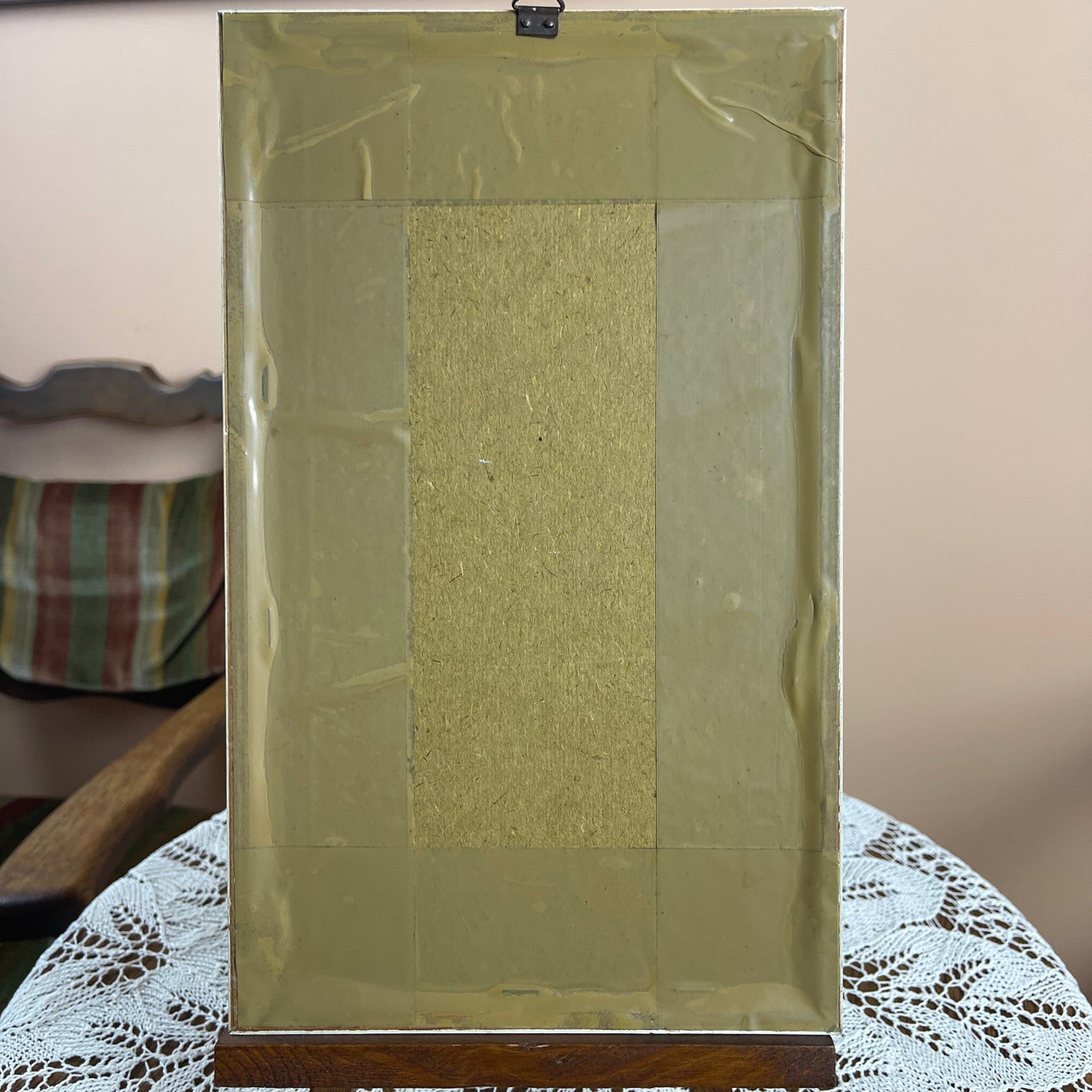 Rectangular frame with a textured center on a lace tablecloth