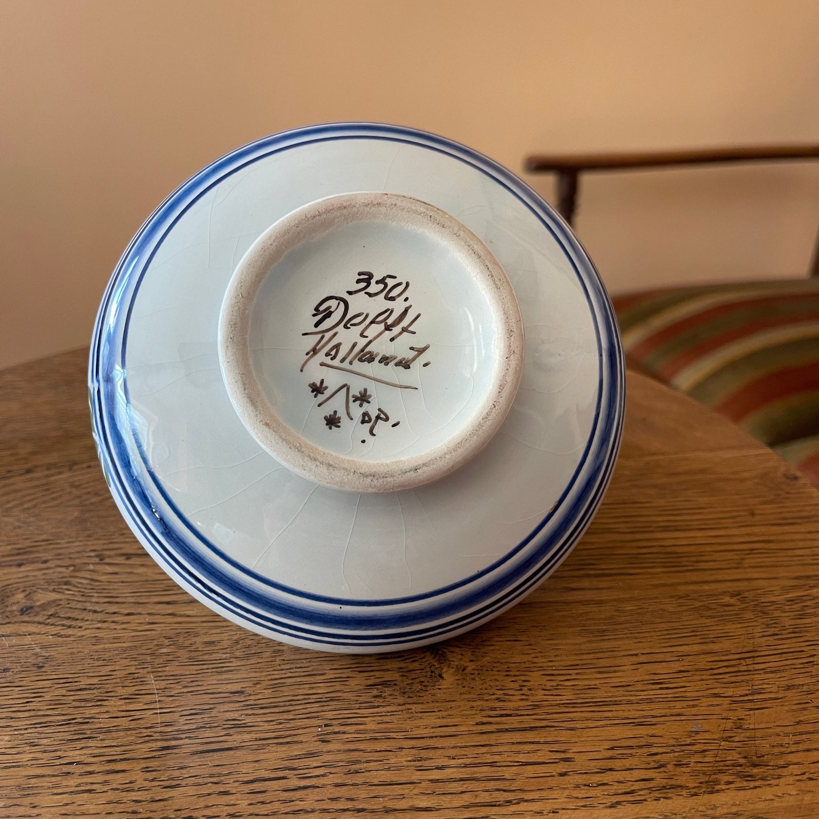 Ceramic bowl with blue rim on a wooden surface