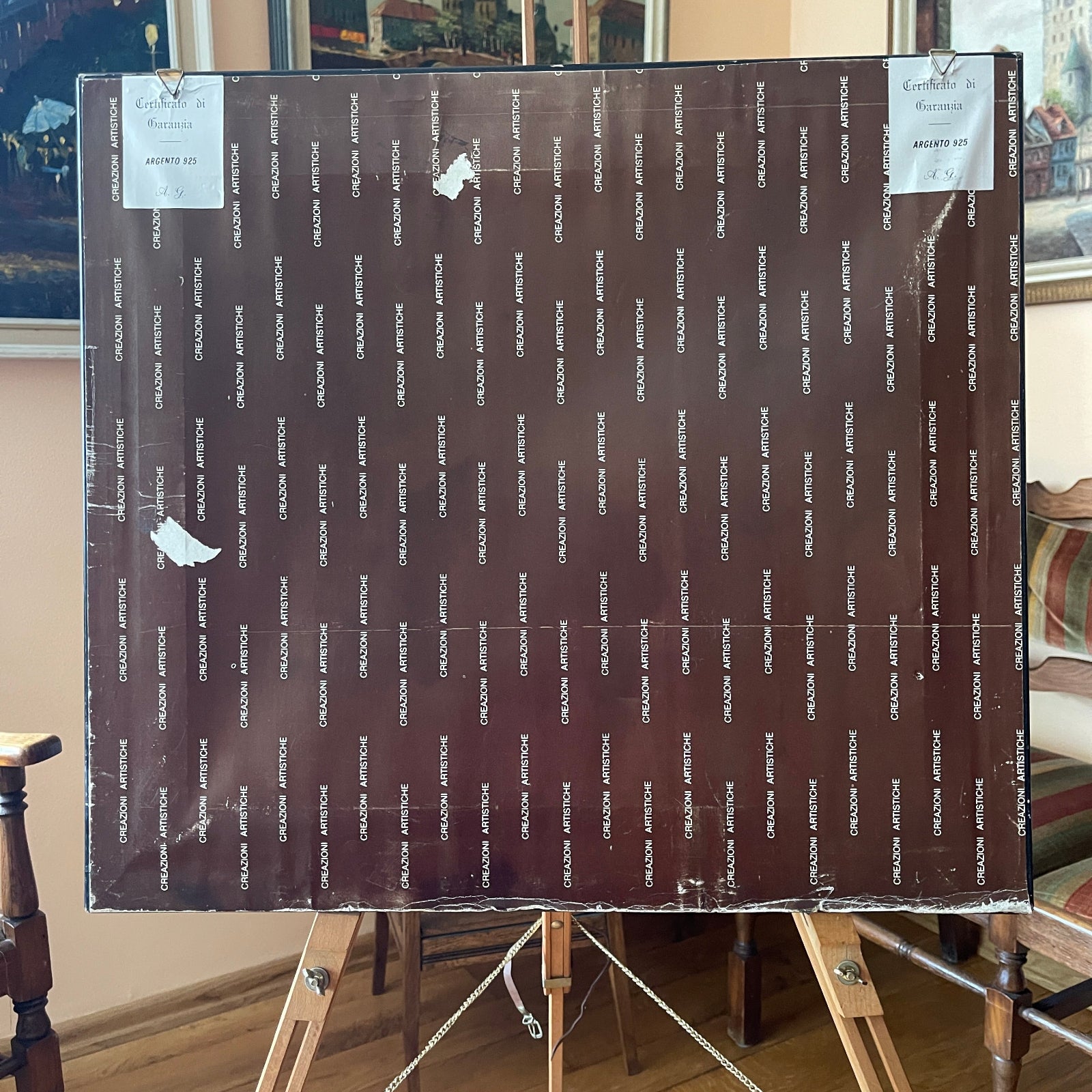 Large brown paper sheet with printed text on an easel in a room setting