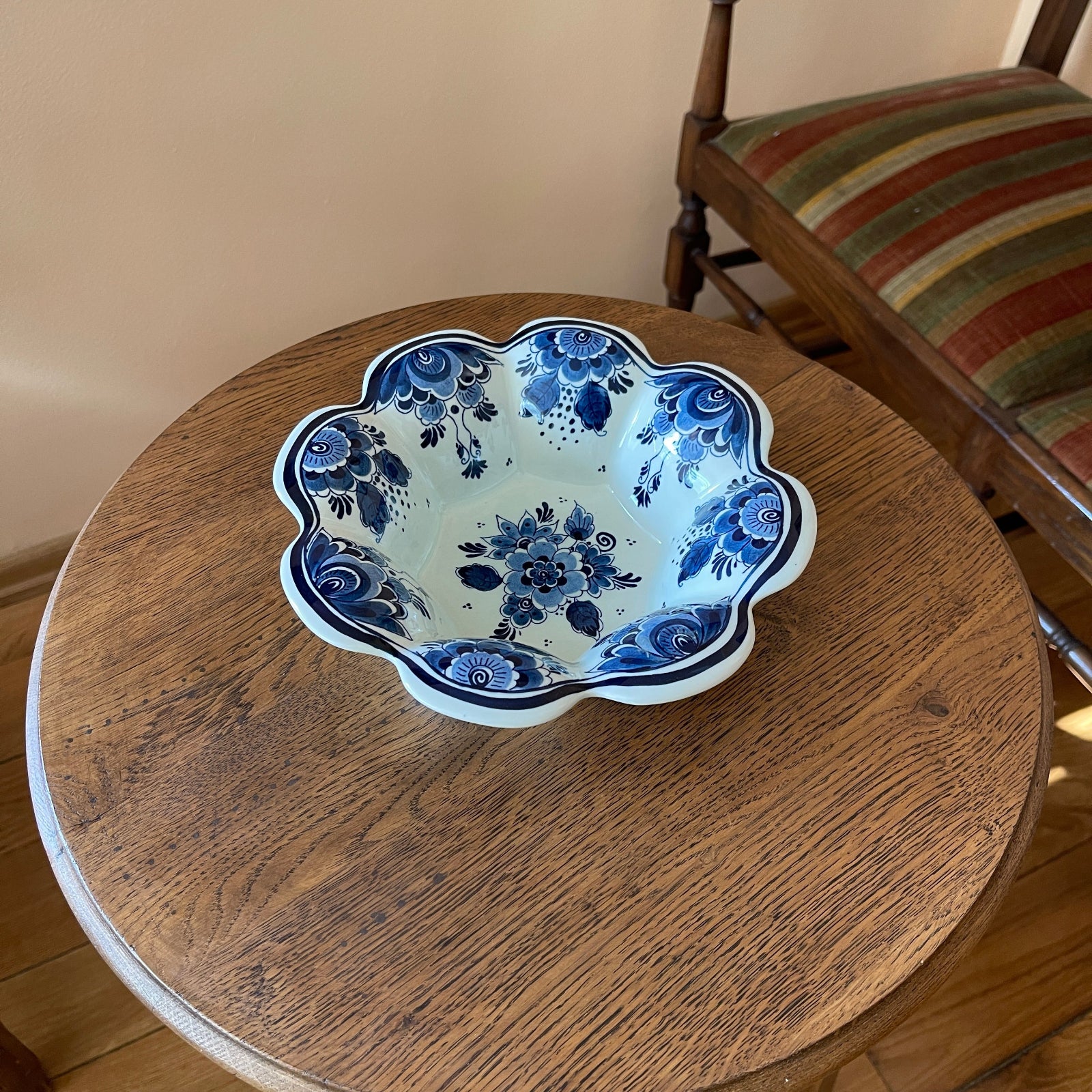 Ceramic bowl with blue floral design on a wooden table