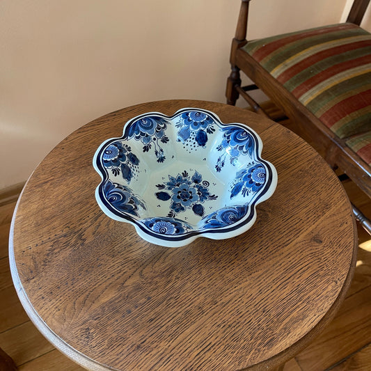 Ceramic bowl with blue floral design on a wooden table