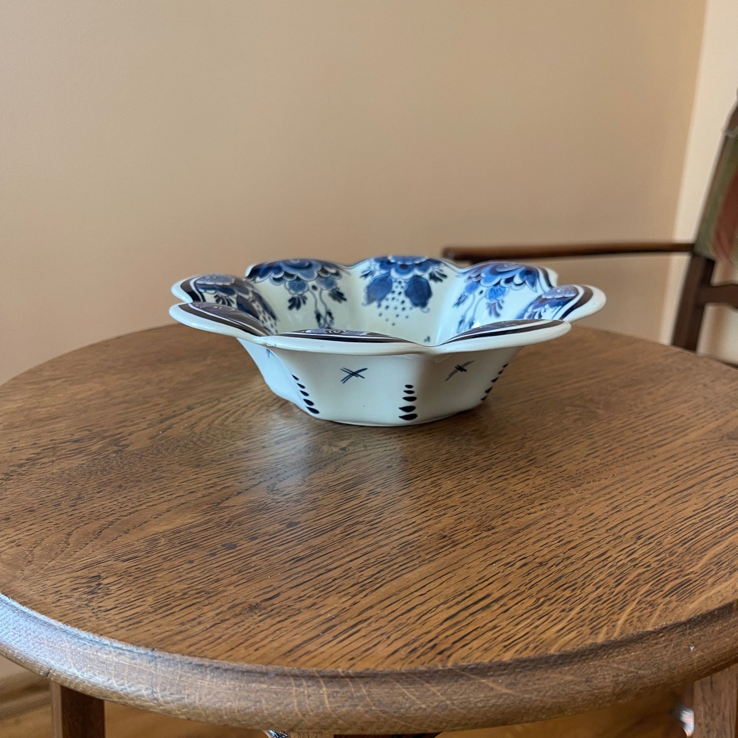 Decorative ceramic bowl with blue patterns on a wooden table