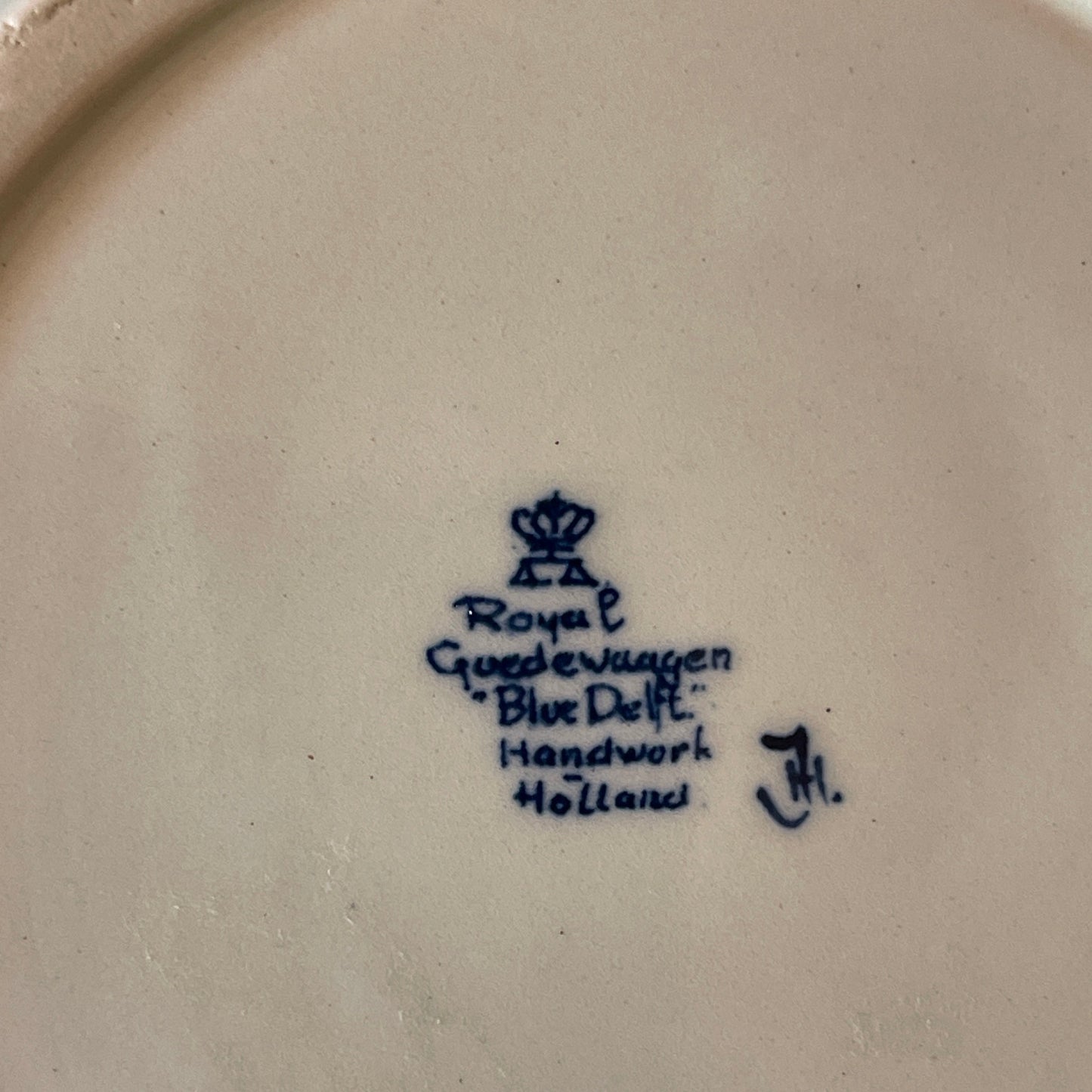 Royal Delft logo and text on a ceramic plate