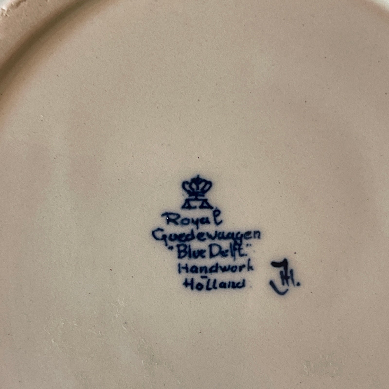 Royal Delft logo and text on a ceramic plate