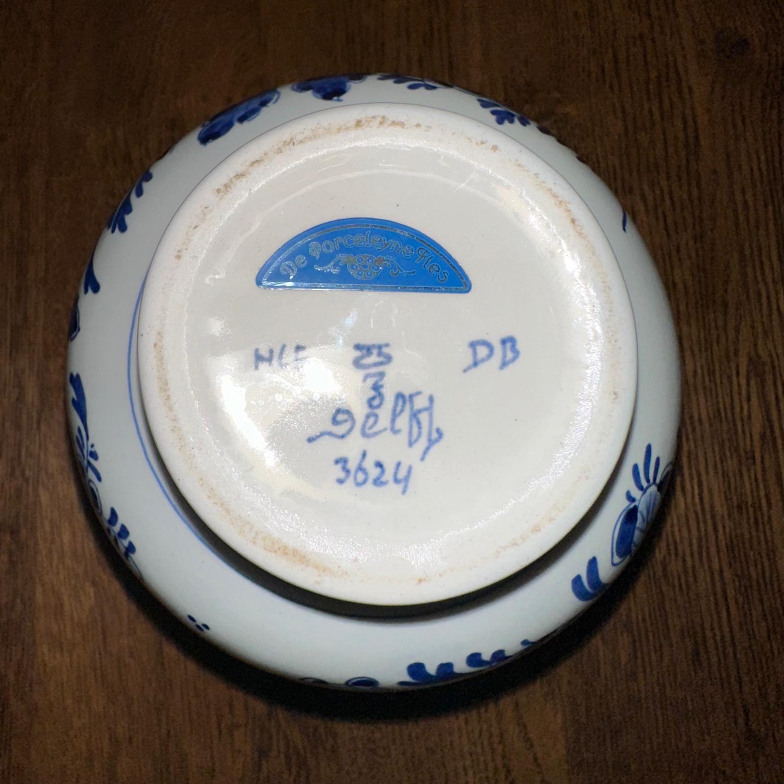 Ceramic bowl with blue floral patterns on a wooden surface
