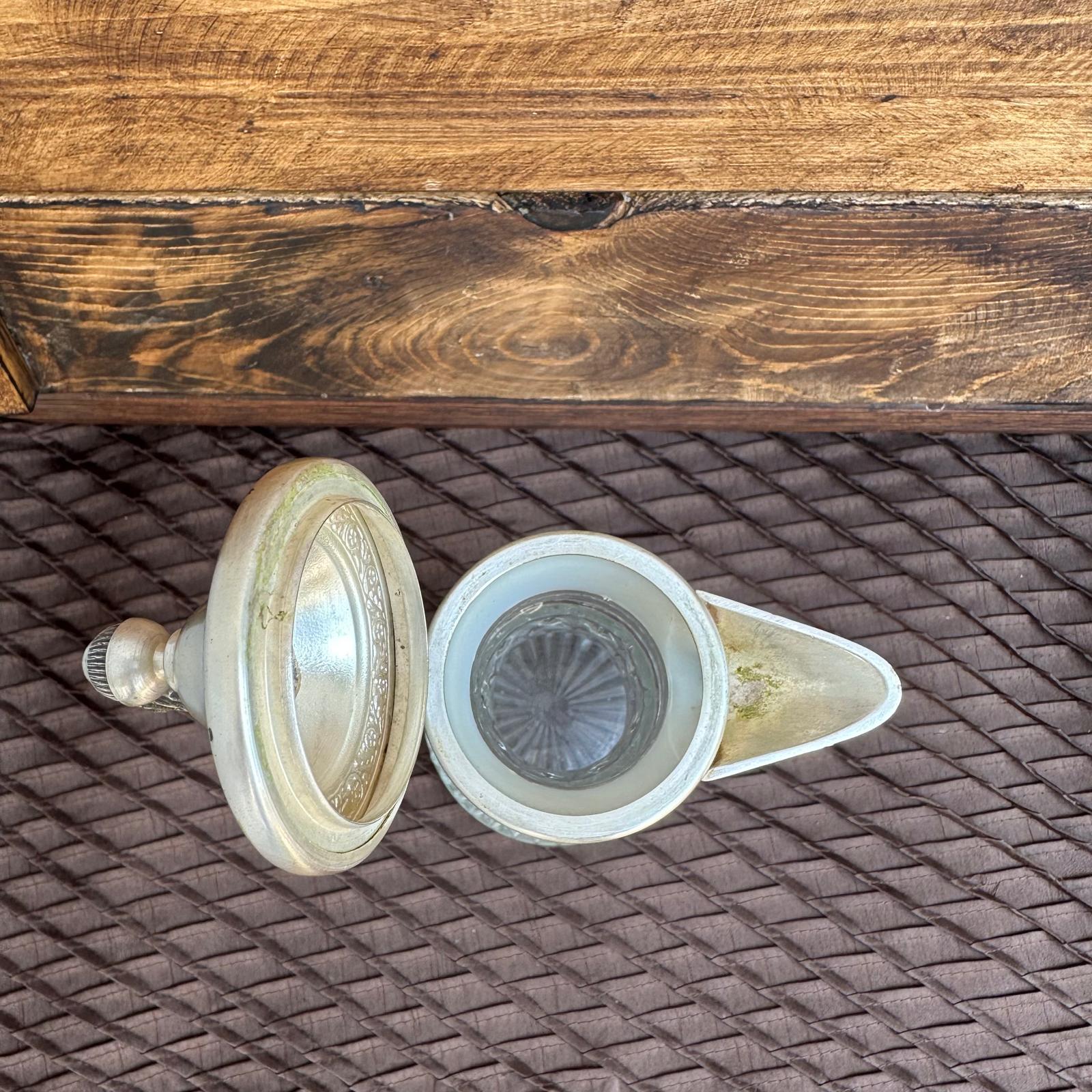 Two light bulb covers on a textured surface